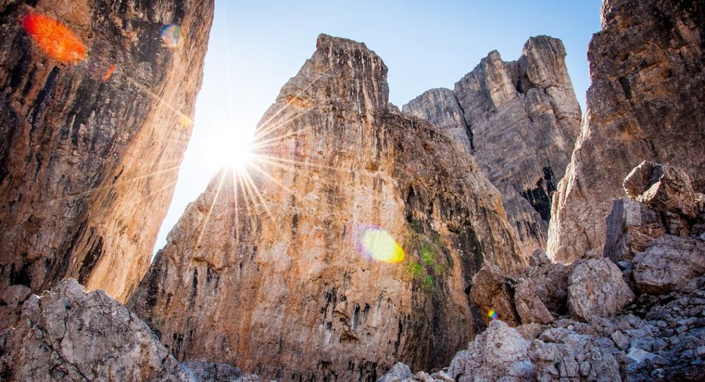 Rocky mountain with sun peeking through