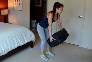 Woman doing a luggage row