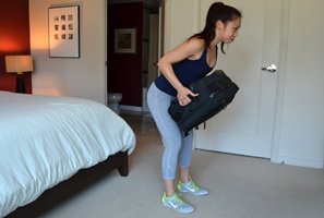 Woman doing a luggage row