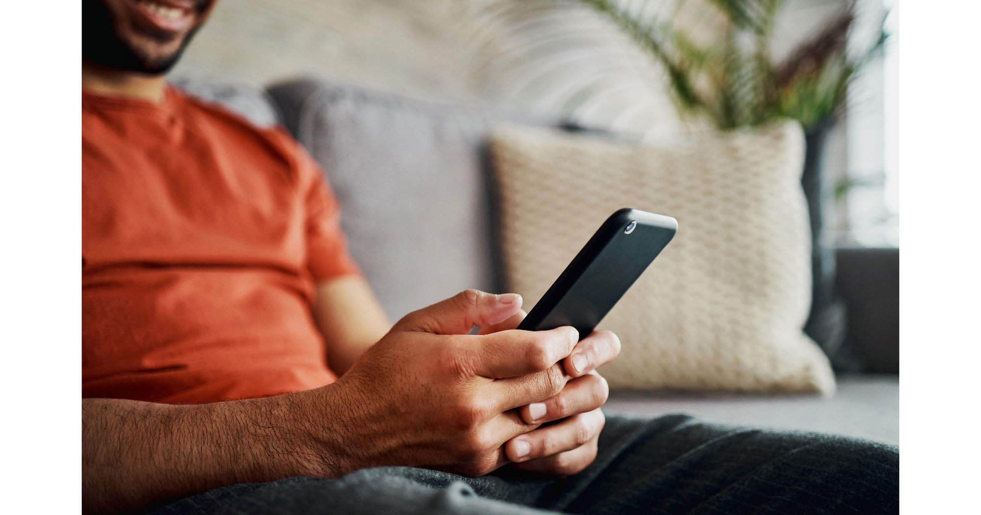 Man scrolling on his phone through social media