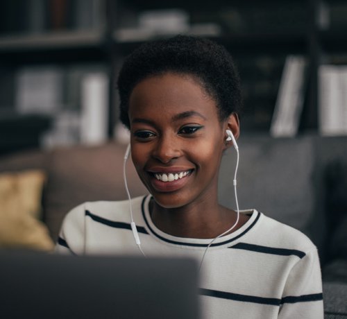Image of Lady with Headphones Smiling