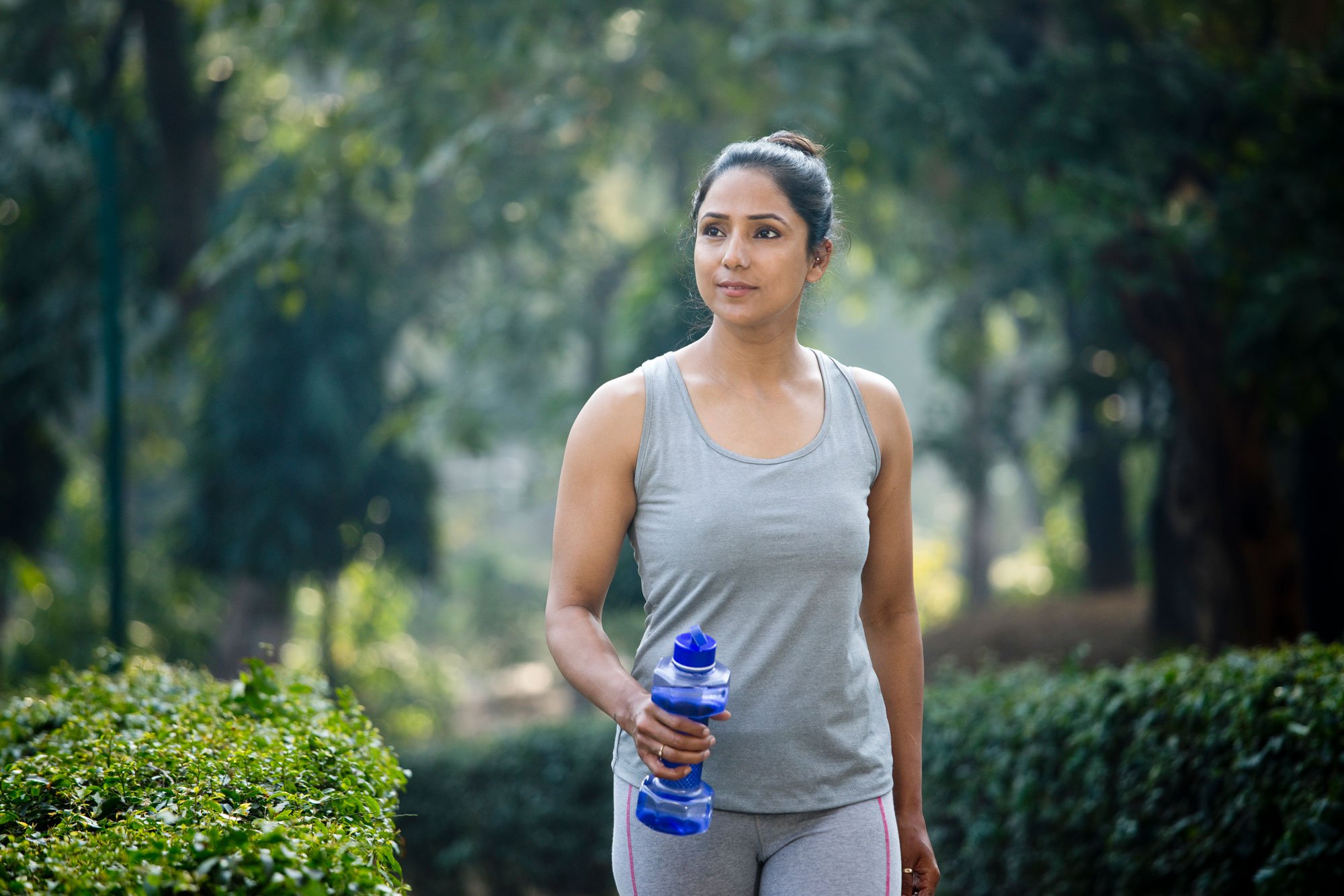 woman walking outside at the park