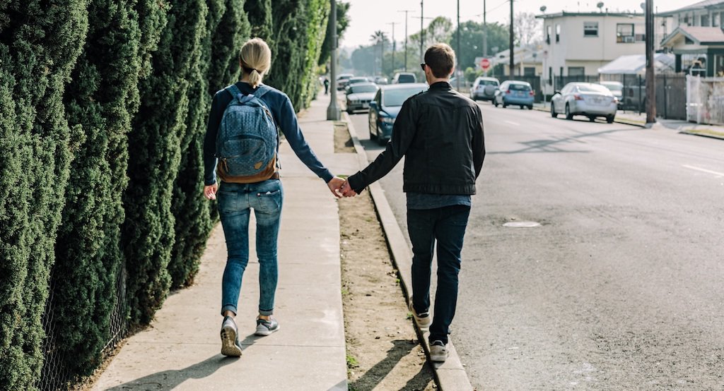 Couple walking and holding hands