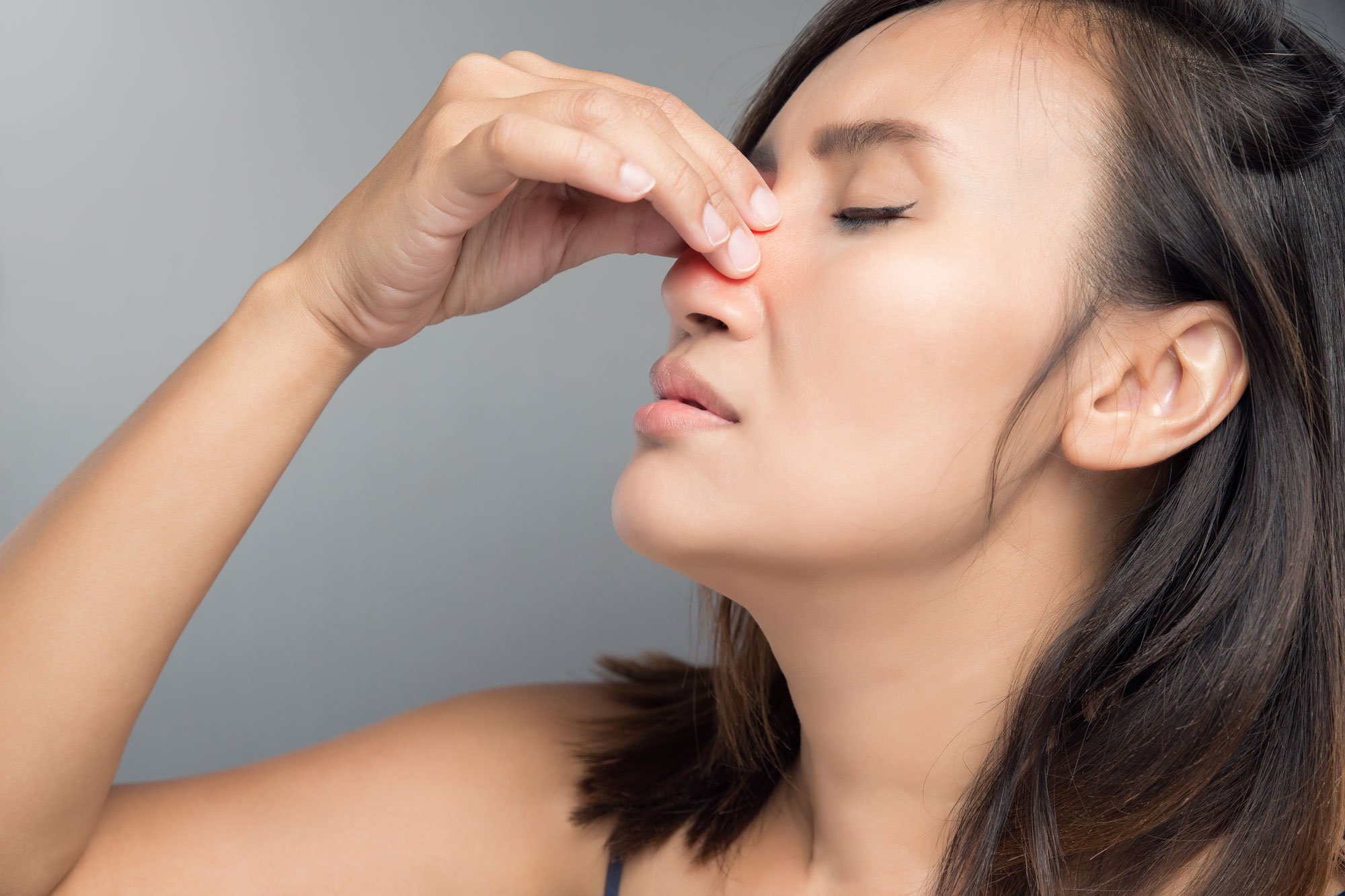 woman-holding-nose.jpg