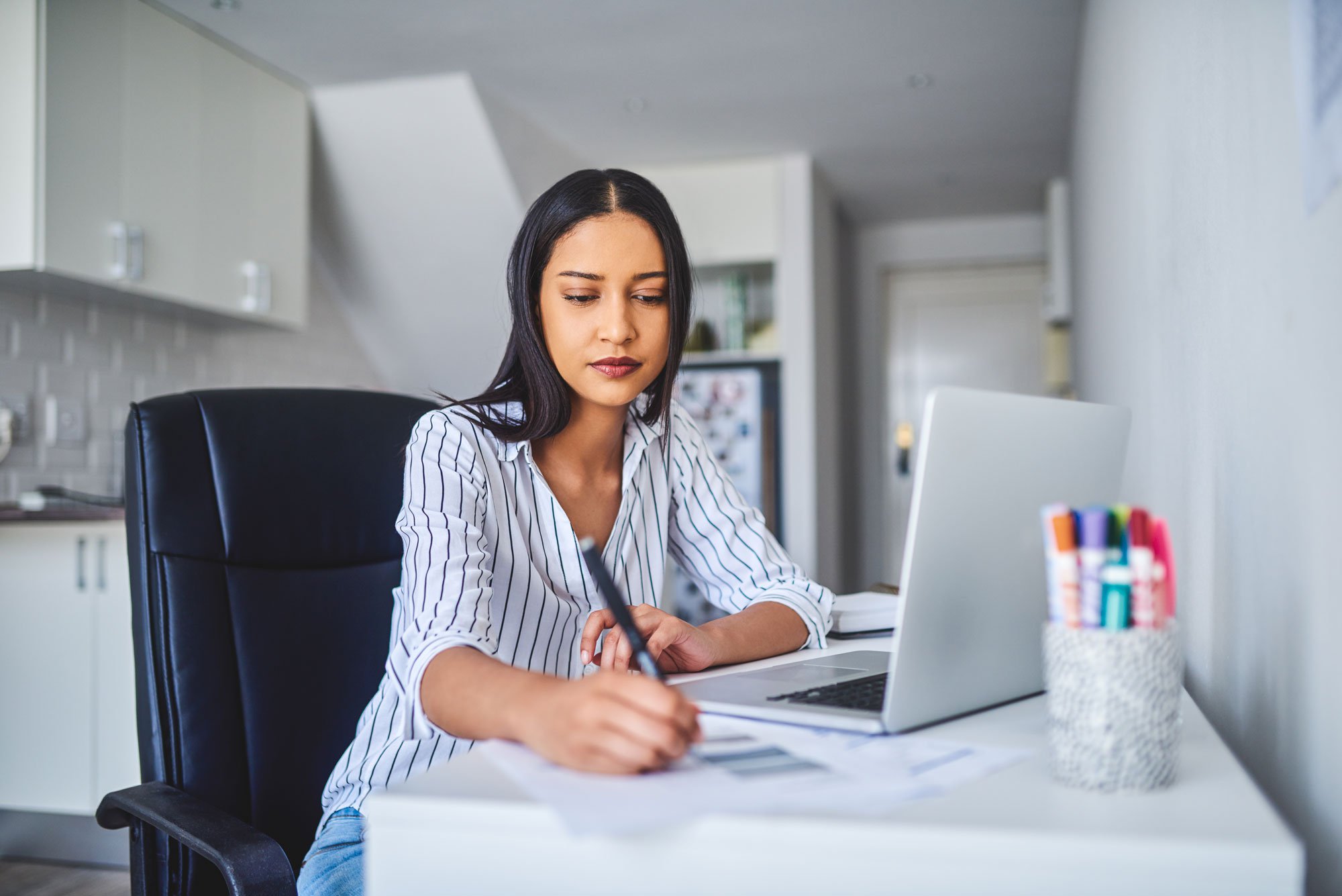 woman signing papers