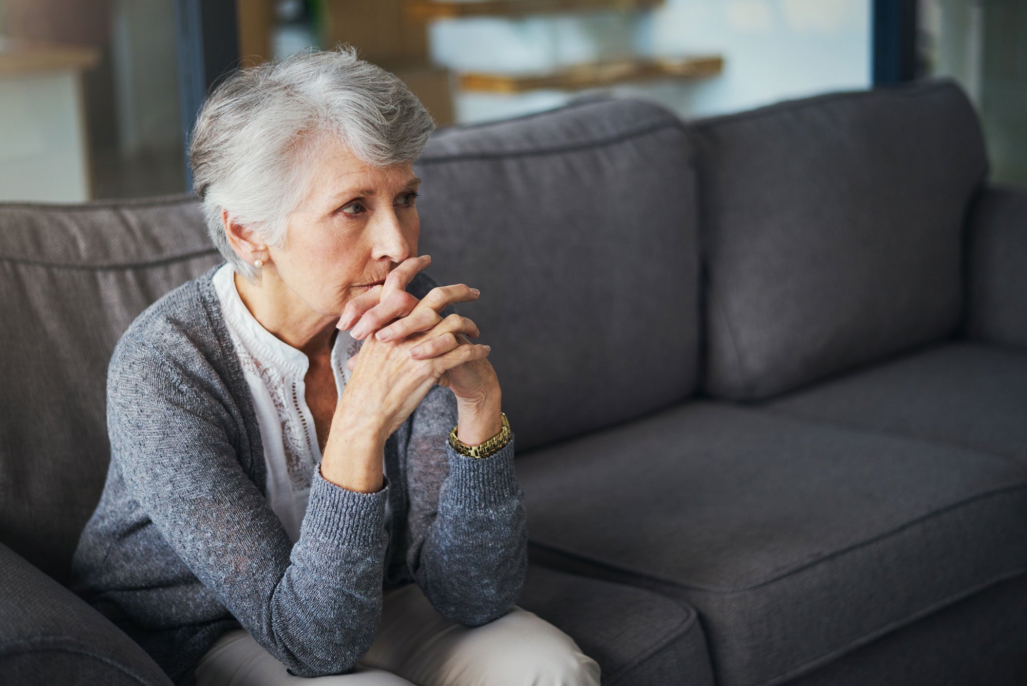 woman-sitting-on-couch.jpg