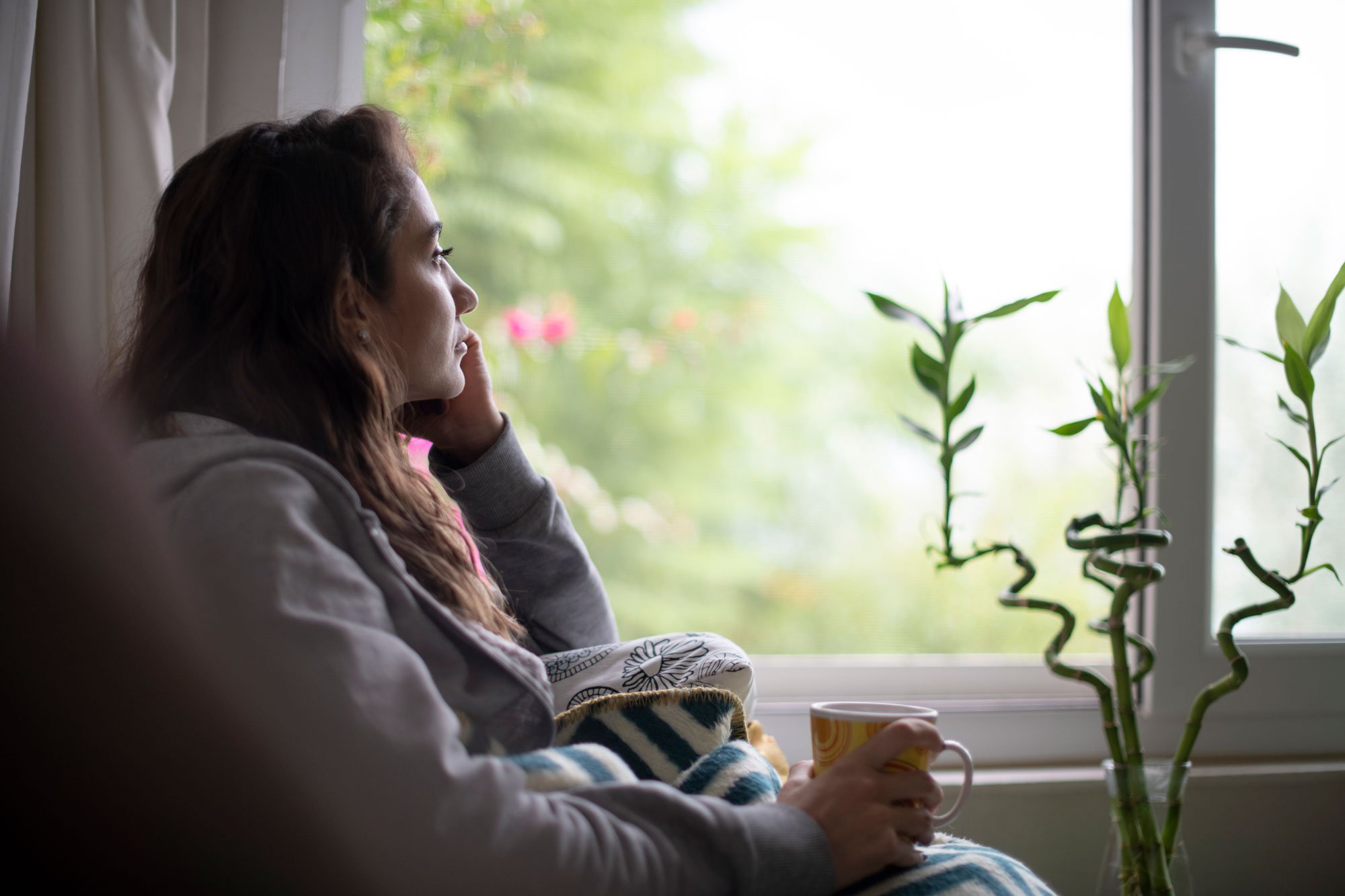 Woman staring out window